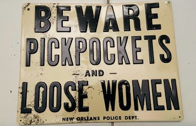 Ande Rooney-Tin pickpockets advertising signs-