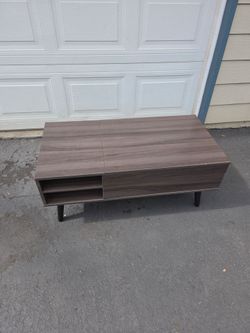Mid-century modern left top coffee table with shelf.
