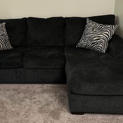 Dark Gray Couch With 2 Pillows 