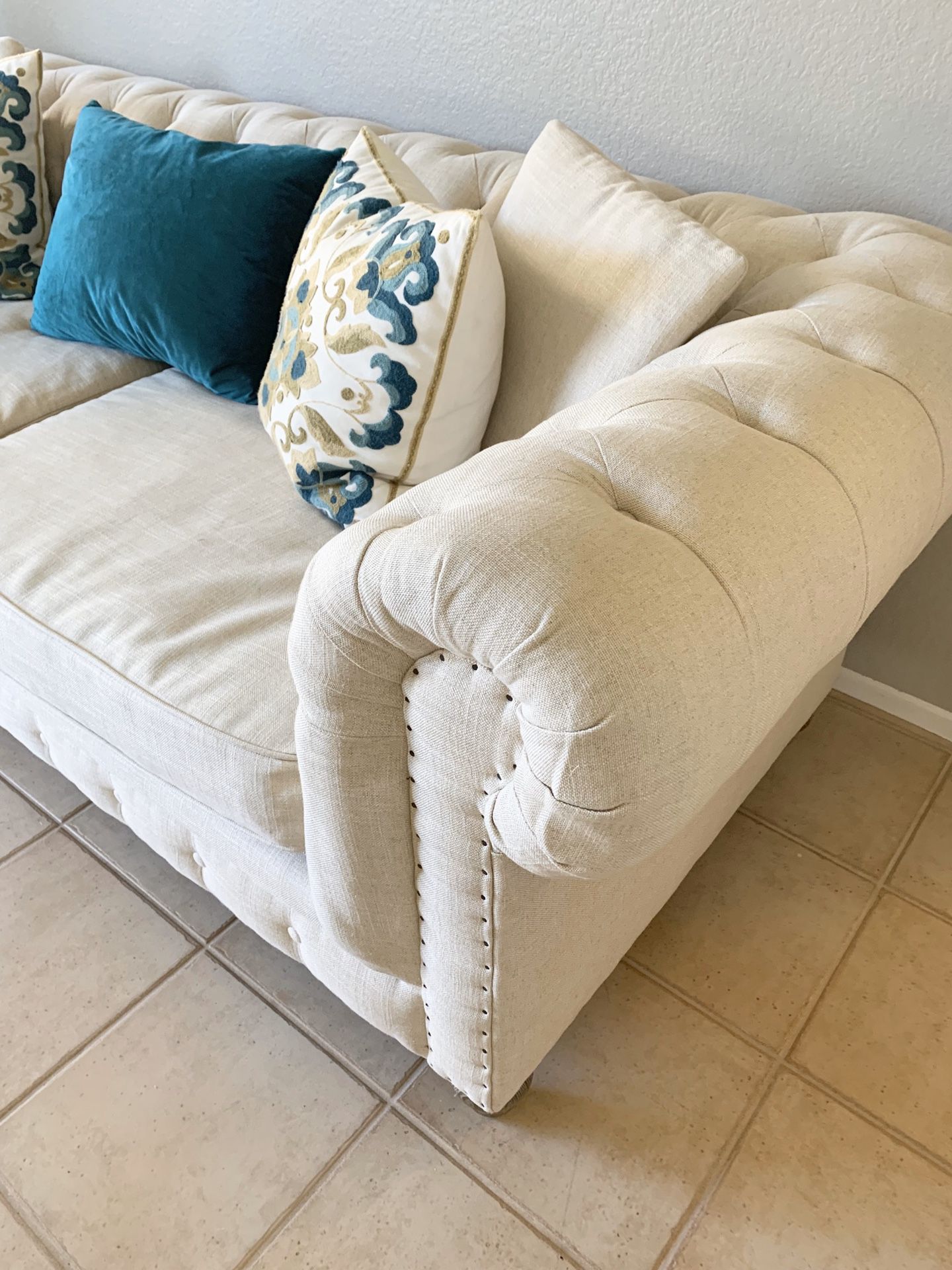 Cream color tuffed sofa couch