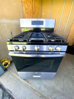 GE gas stove 5 burners stainless st with griddle.  30”