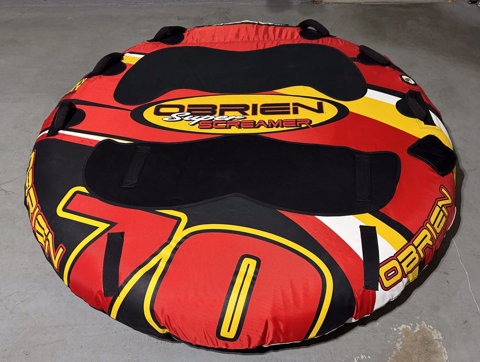 O'Brien Super Screamer towable tube with three ski vests
