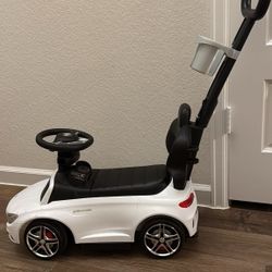 kids’ push/ride-on toy modeled after a Mercedes-Benz AMG