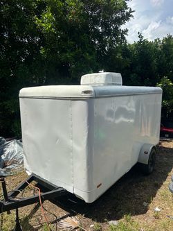 Very clean 6 x 12 enclosed trailer with air conditioner and foldable beds very solid gate title in hand