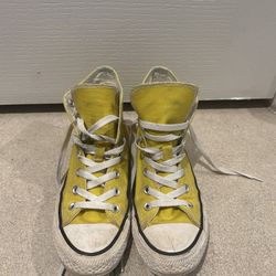 yellow Converse high tops 