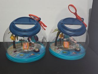 This is a B. Toys Tiki Retreat bug catcher set, which includes a dome-shaped hotel, a magnifying lid, and tweezers for exploring nature.