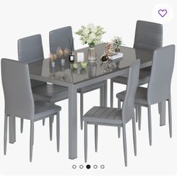 Nadeane 7 - Piece Dining Set with Faux Leather Upholstered Dining Chairs!