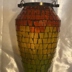 Faded rainbow, vase shaped hanging candle holder.