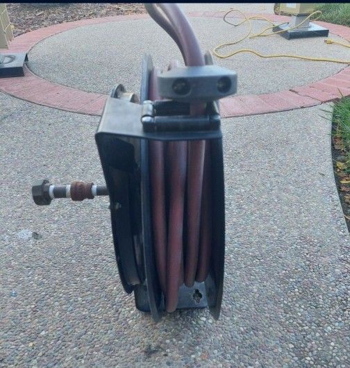 Air hose reel and air hose. 3/8" x 50'.Westward 6nU34,,works perfectly.