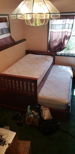 Twin wood bed with trundle