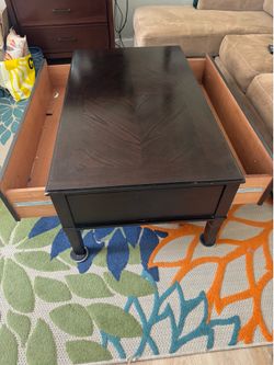 Dark brown coffee table with two drawers