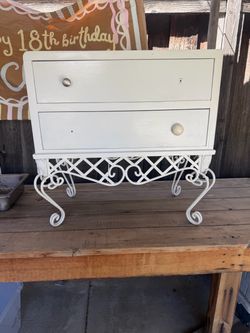 Wrought iron stand with small dresser