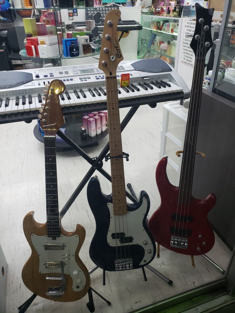 Bass guitars and electric guitar