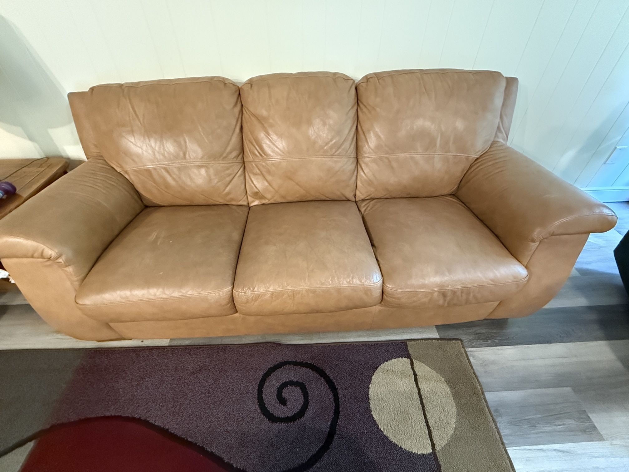 A Pair Of Leather Sofas