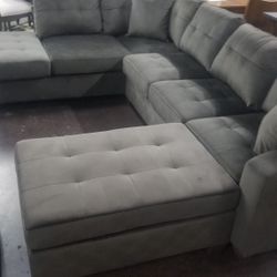 Chocolate brown sectional with ottoman