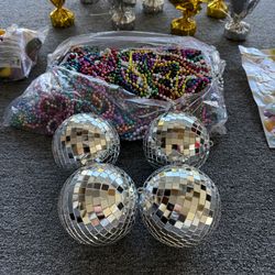 Party supplies!  Disco balls, table toppers, Mardi Gras beads!