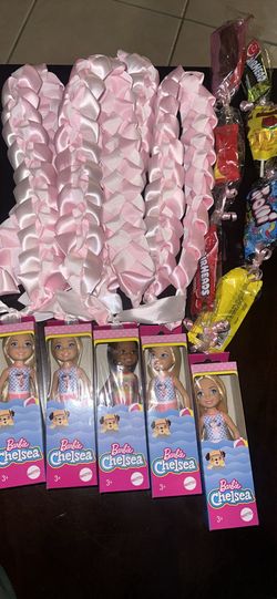 Barbie Chelsea dolls, pink ribbon leis, and candy leis -preschool