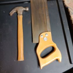 Hand Saw And Hammer