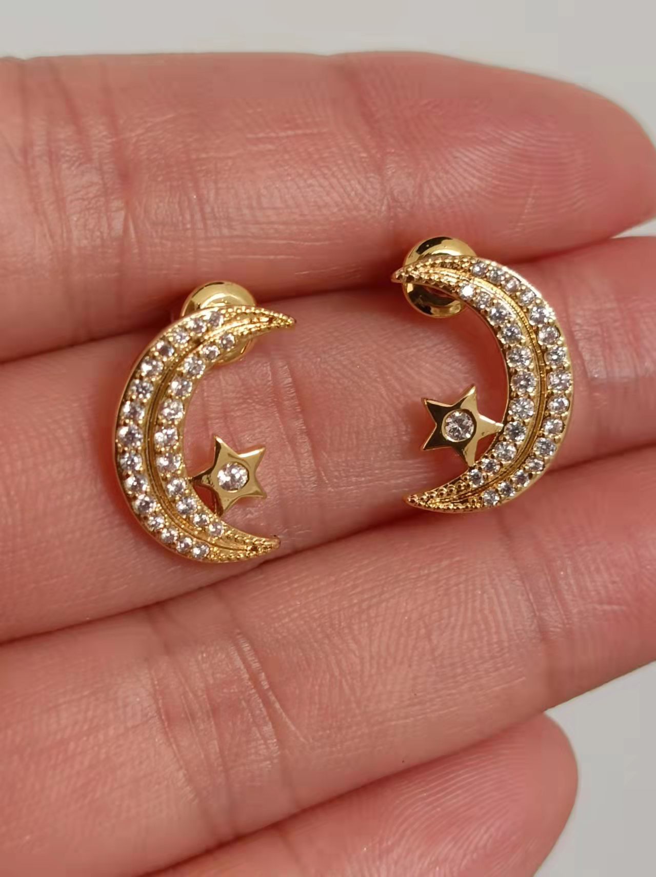 Gold moon ear studs