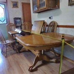 Oak Dining table w claw foot & 6 chairs, pop up center leaf