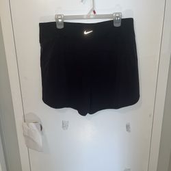 Nike Woman’s running shorts.Dri-Fit size XL. Black.NWT Nike Dri-Fit technology moves sweat away from your skin for quicker evaporation, helping you st