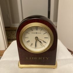 Howard Miller clock. “Liberty property trust “ on bottom of the clock
