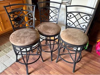 3 Bar Stools.  Excellent condition, black iron with brown suede seat cushions that swivel.  Height: 37 in. total, seat to floor is 25 in.