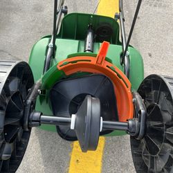 Turf Builder EdgeGuard Mini Push Broadcast Spreader Holds up