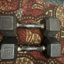 Two  15 lb dumbbells  $1 per pound