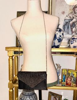 Vintage Talbots brand bag, made of black or dark brown canvas with a tonal monogram geometric pattern in the shape of a "T" and finished in genuine le