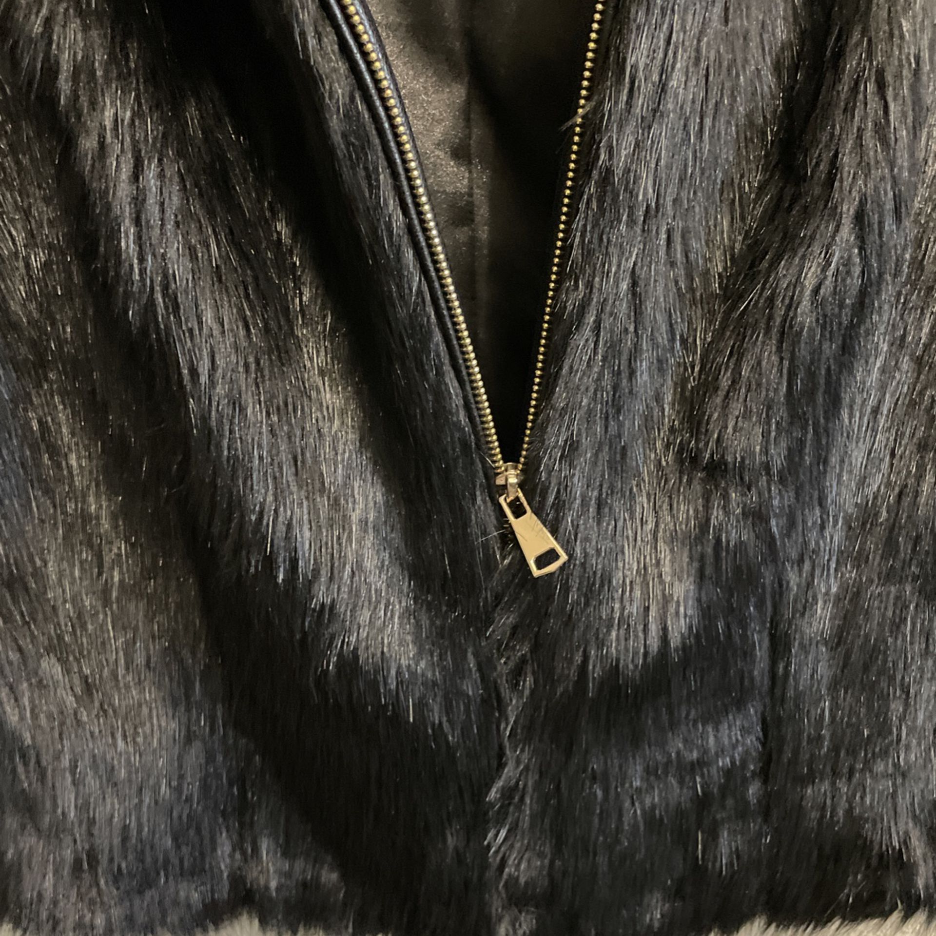 “fabulous furs” faux fur and leather vest