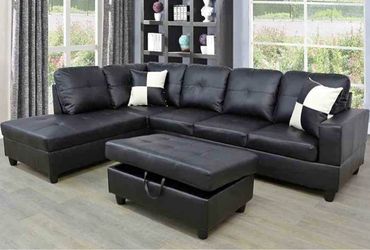Black leather sectional couch and ottoman