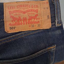 Un washed, Shrink To Fit Levi's 501 Original Button Fly jeans.