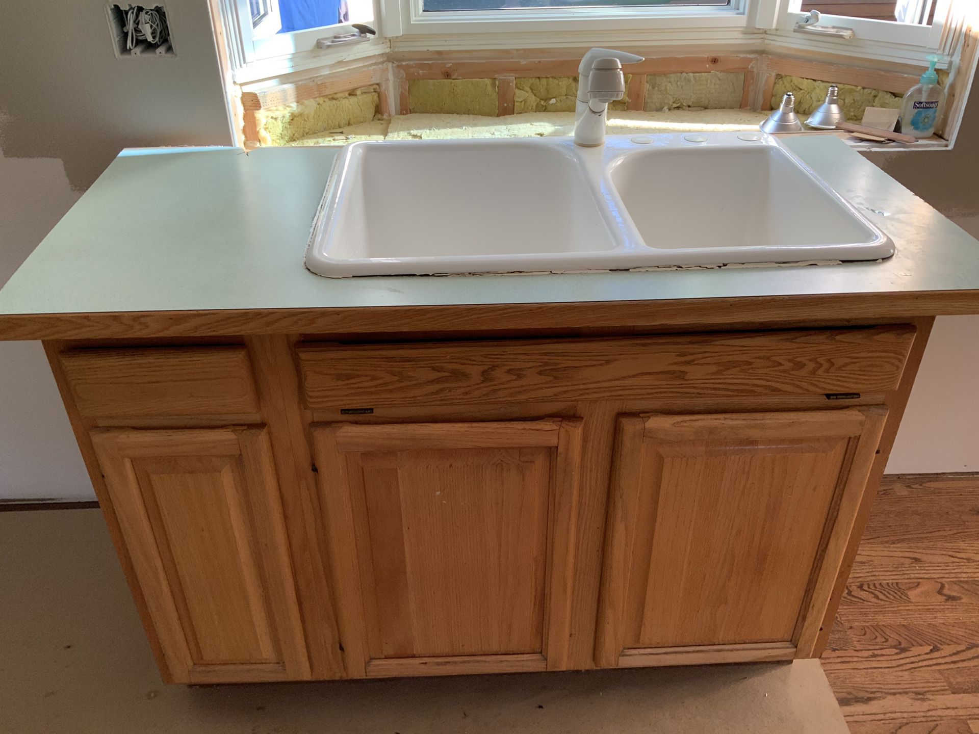 Kitchen sink, faucet, and cabinet