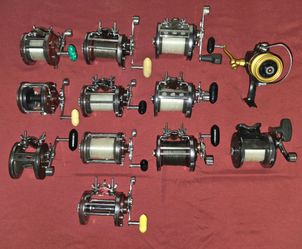 Penn Fishing Reels, Shimano Reel Bag, and Various Reel Covers