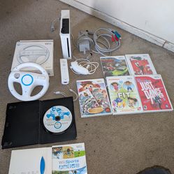 Nintendo wii system+ games including Mario kart and Wii sports ((sold as a bundle)) missing sensor