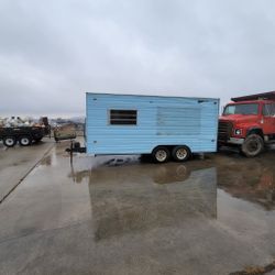 Enclosed trailer with garage door. 20 ft cargo.