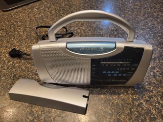 Emerson small radio battery operated and also a cord The selected region shows an Emerson AM/FM/TV Sound Portable Instant Weather Radio (Model RP6247S