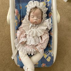 Porcelain Doll In Carrier