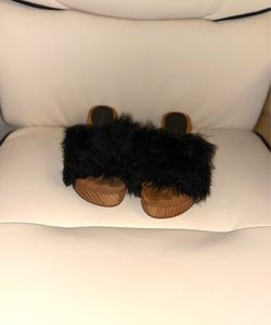 Free People "Sonnet" clogs, characterized by their wooden sole and black synthetic leather details. Size 7