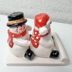 Vintage Ceramic Snowman Sitting on Sled Salt and Pepper Shakers w/ Stoppers 