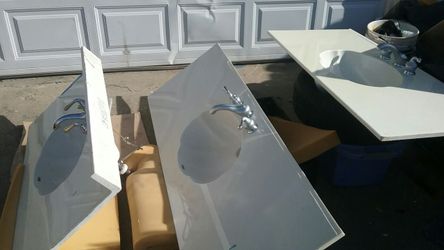 Vanity tops with new faucets and new hoses Hunter and $135 each