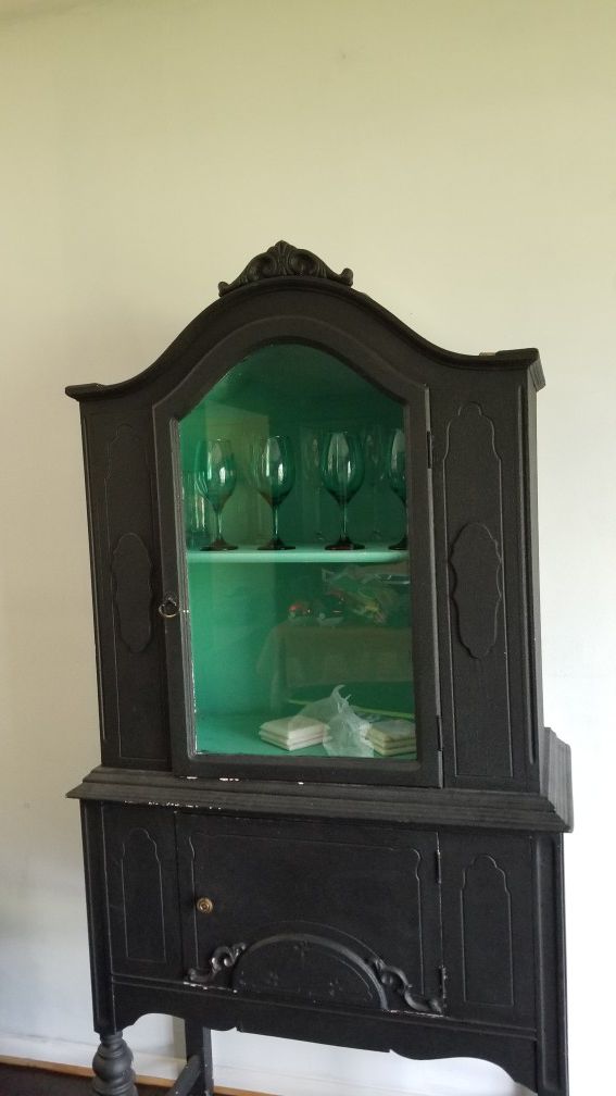 Antique styled black painted wood cabinet.