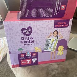 Box Of Baby Girl Clothes And Inflatable Cow 