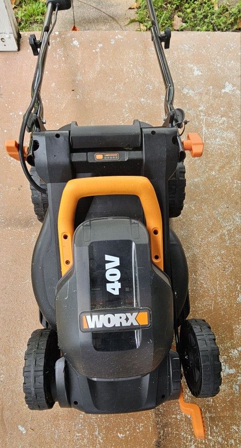 WORX ELECTRIC LAWNMOWER....14 INCHES.....40 VOLT BATTERY AND CHARGER INCLUDED.....$ 150
