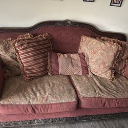 Maroon love seat and couch in fair condition, as well as two end tables!