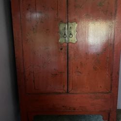 Chinese Red Lacquered 18th Century Qing Dynasty Cabinet with Gilt Chinoiserie Motifs and Scalloped Brass Hardware 