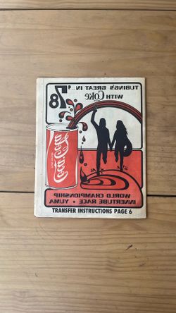 Coca Cola Transfer In A Newspaper
