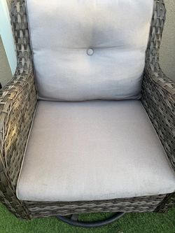 2 rocking swivel chairs and table