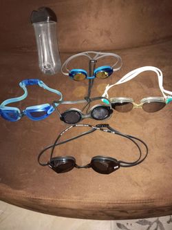 5 PAIRS SWEMING GLASSES-TYR;QUIK SILVER;SPEEDO WITH ONE CASE. $1 EACHTOTAL$5